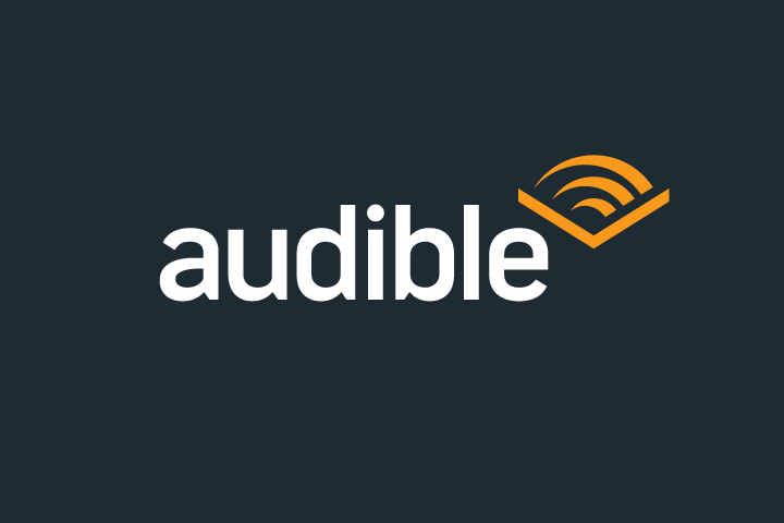 Logo for Audible.com that links to a page featuring links to audiobooks read by Scot Wilcox, available for sale on Audible.